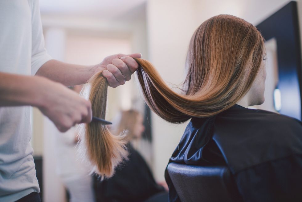 Woman having her hair cut