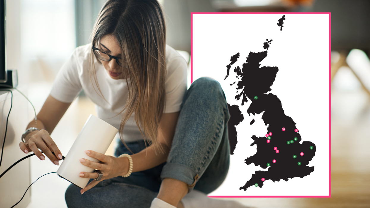 woman holding a Wi-Fi router with a map of the UK