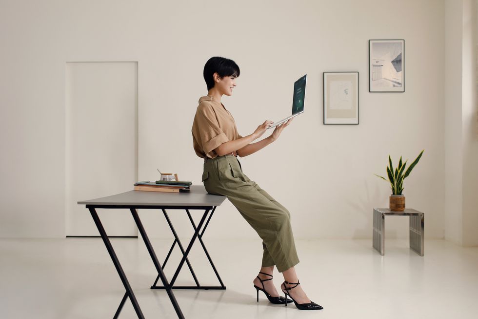 woman holding acer swift air 16 laptop