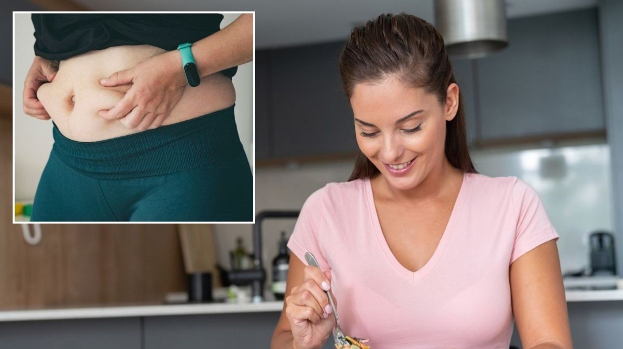 Woman holding belly fat / Woman eating healthy meal