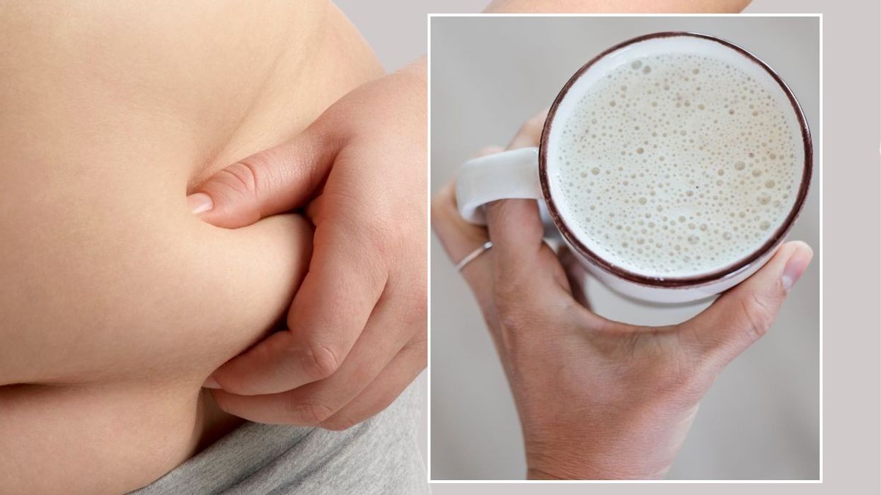 woman holding belly fat