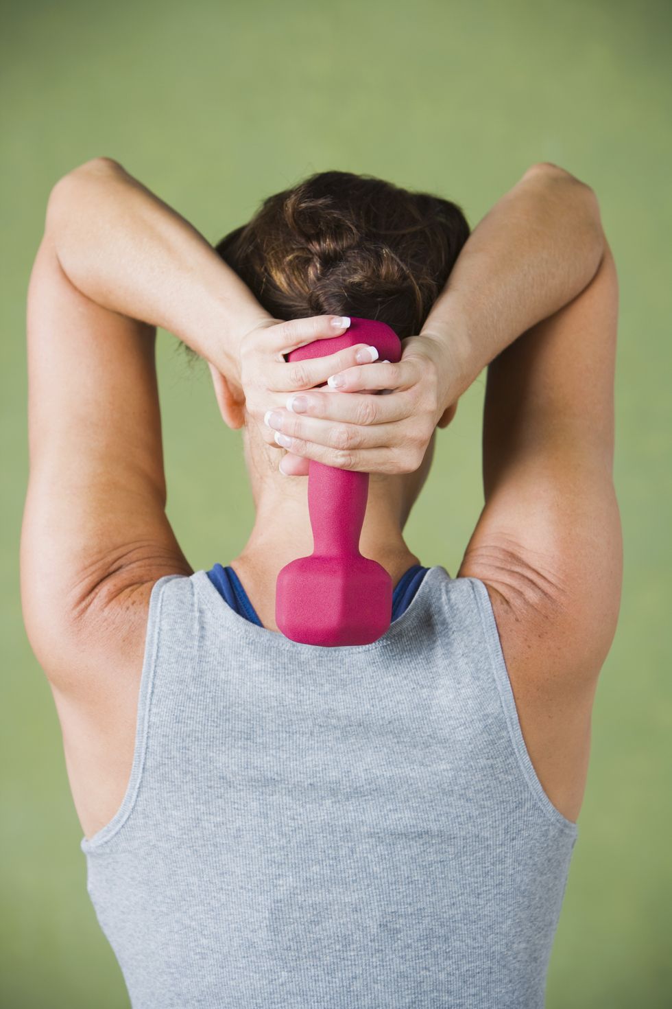 Woman holding dumbbell