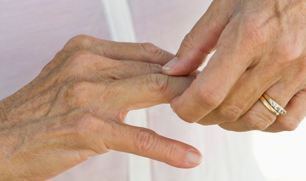 woman holding fingers
