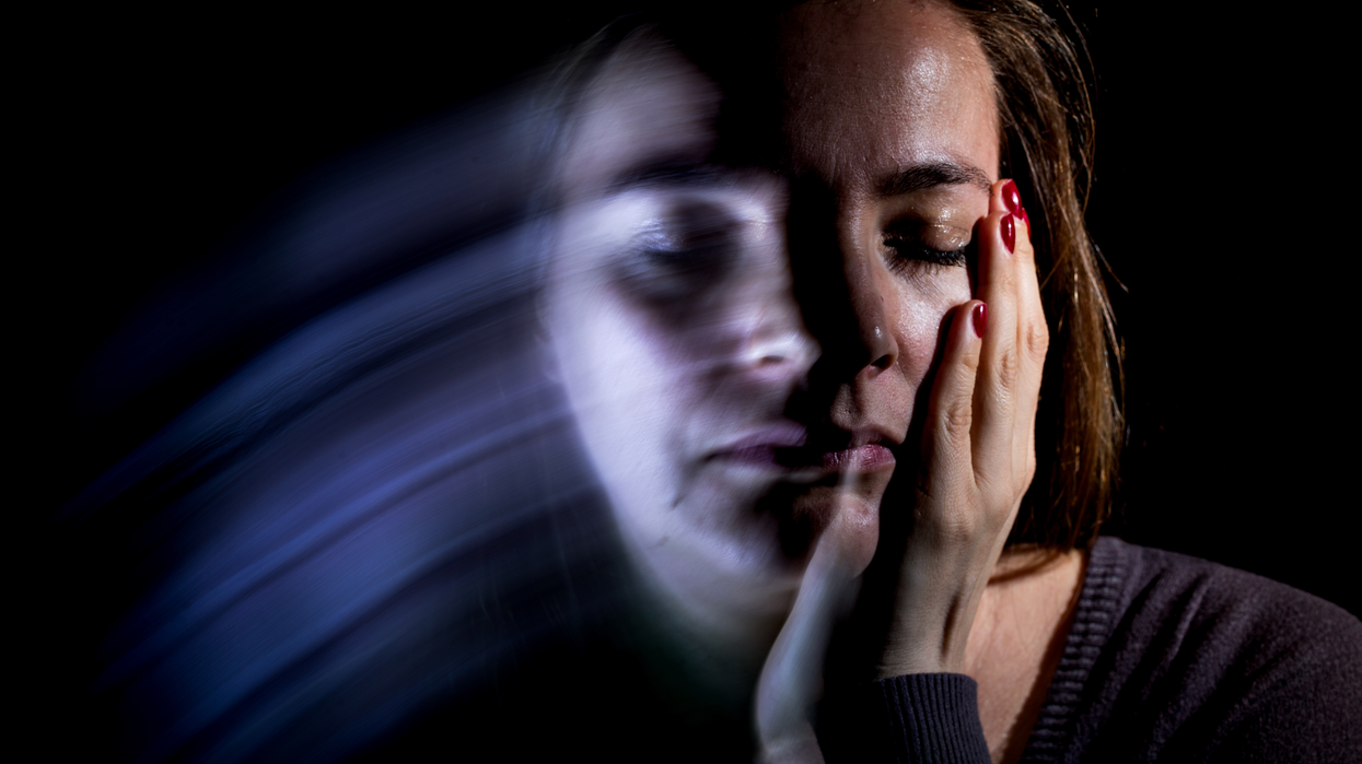 Woman holding her face