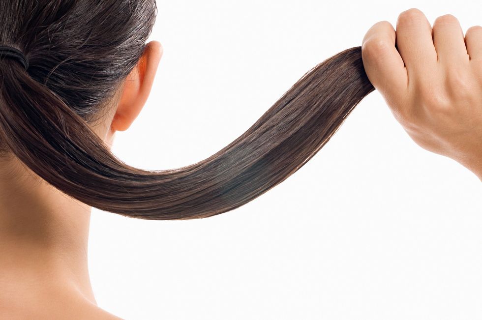 Woman holding her hair