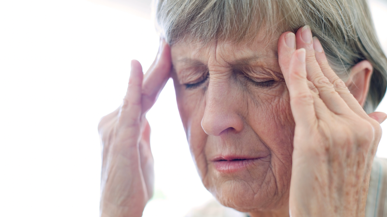 Woman holding her head