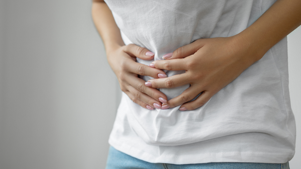 Woman holding her stomach