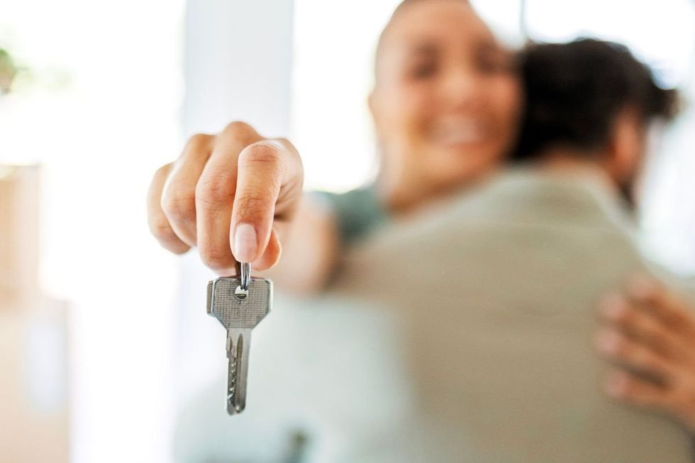 WOMAN HOLDING KEYS