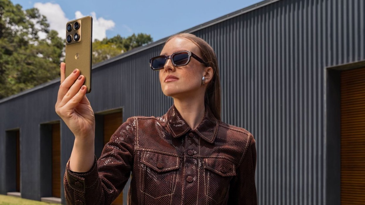 Woman holding Motorola Signature