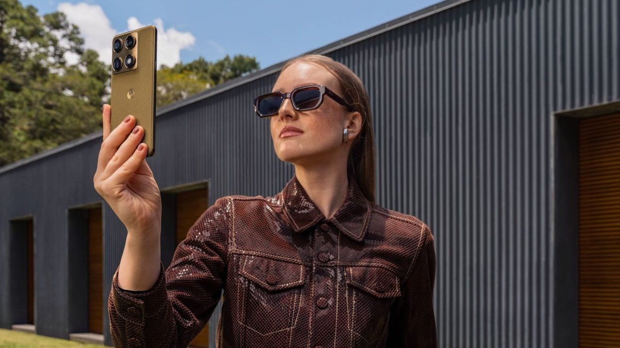 Woman holding Motorola Signature