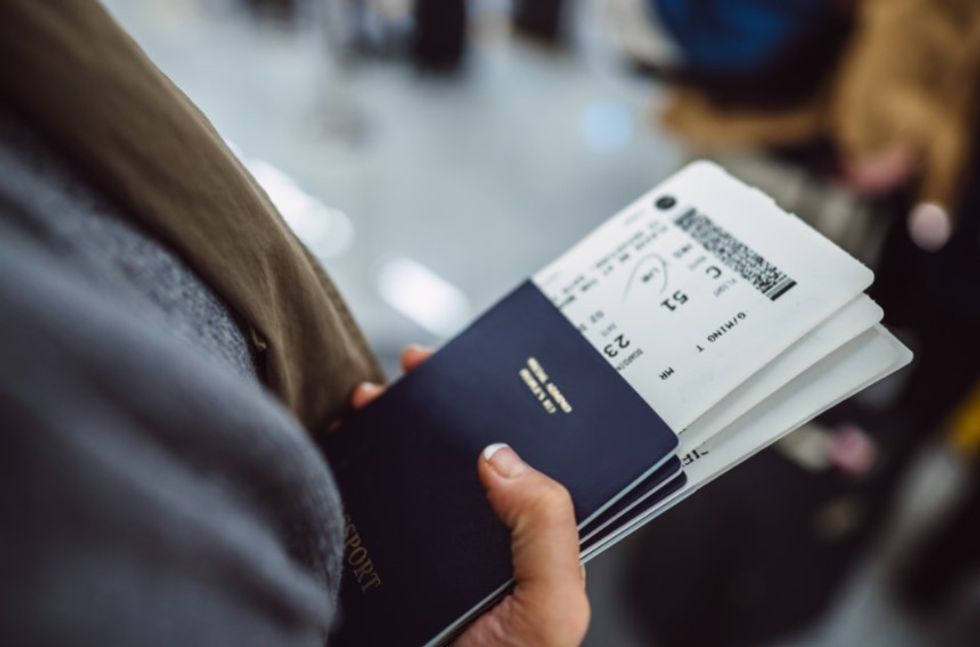 woman holding passports