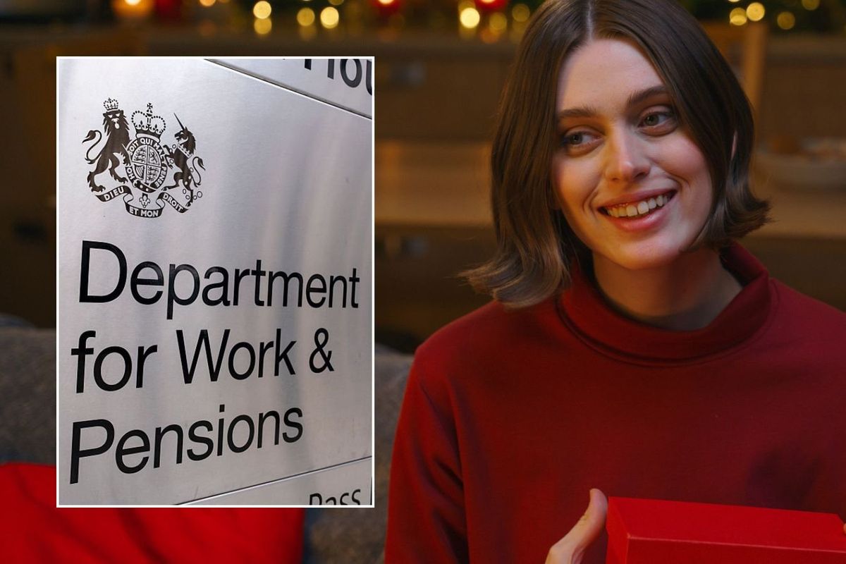 Woman holding present and DWP sign