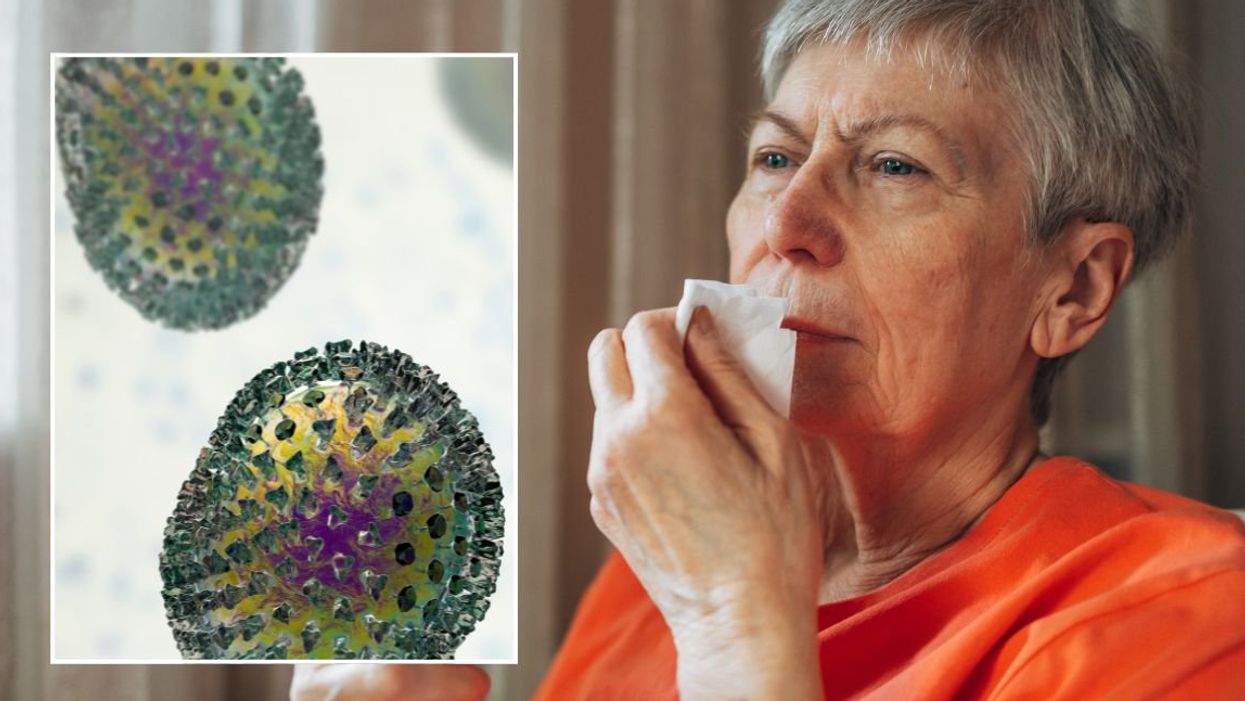 WOMAN HOLDING TISSUE TO NOSE