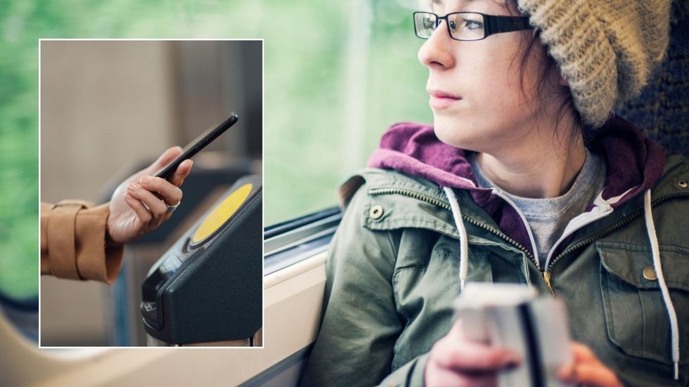 Woman holding train ticket