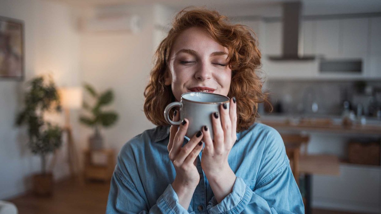 Woman holding up coffee mug