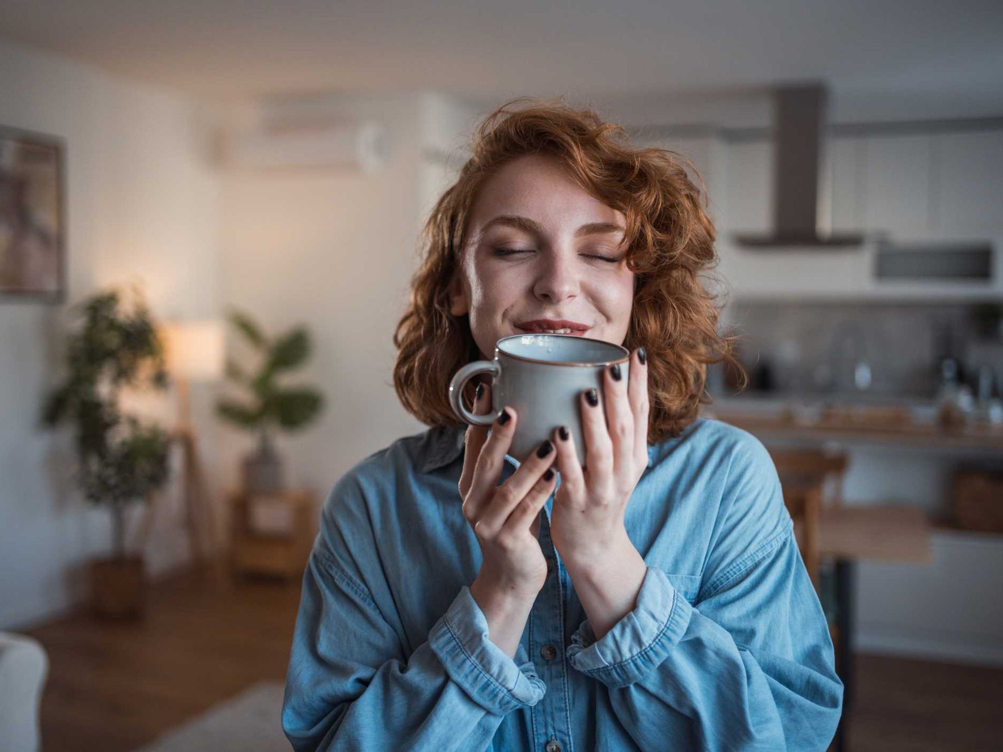 Woman holding up coffee mug