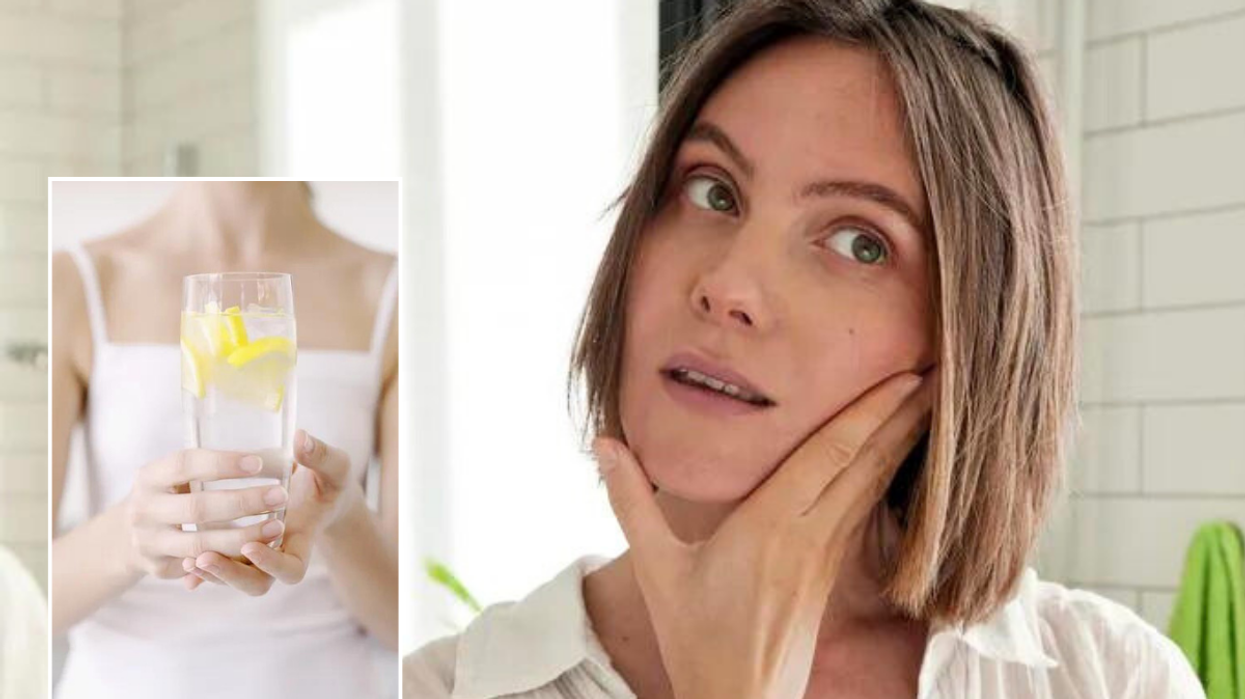 Woman holding water / facial massage