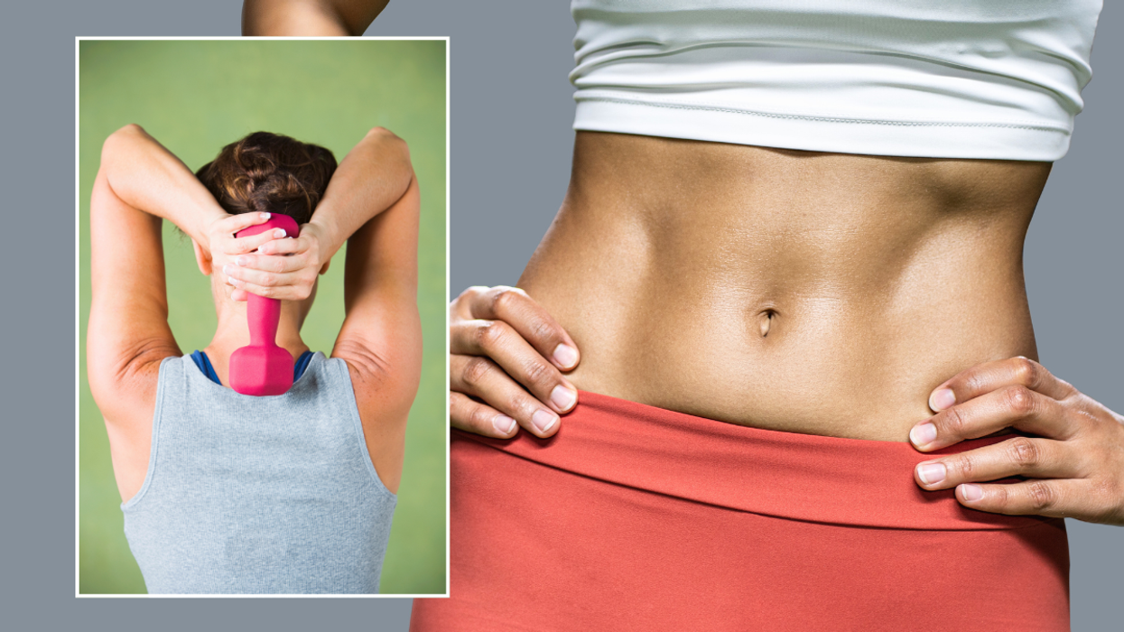 Woman holding weight / toned abs