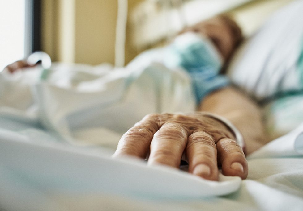 Woman in a hospital bed