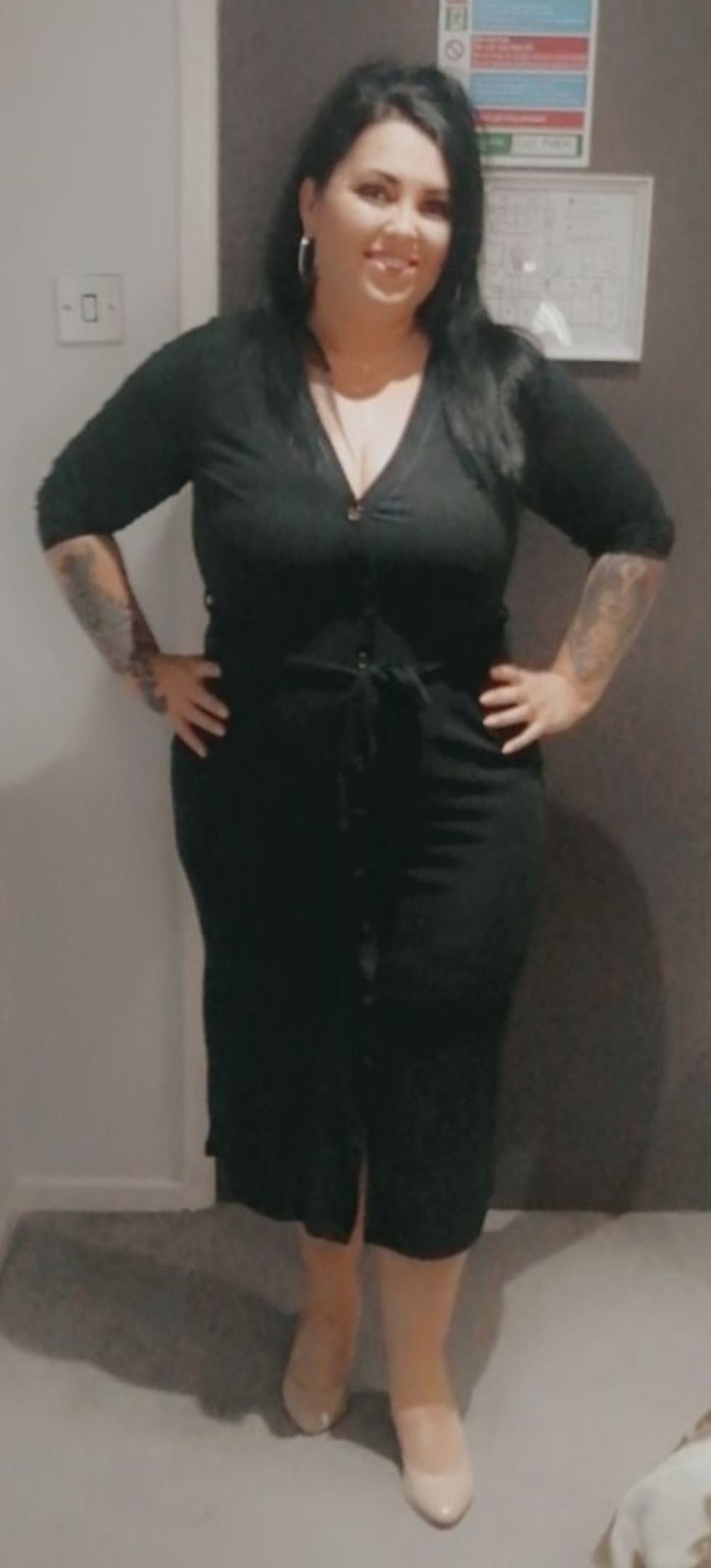 Woman in black dress after weight loss