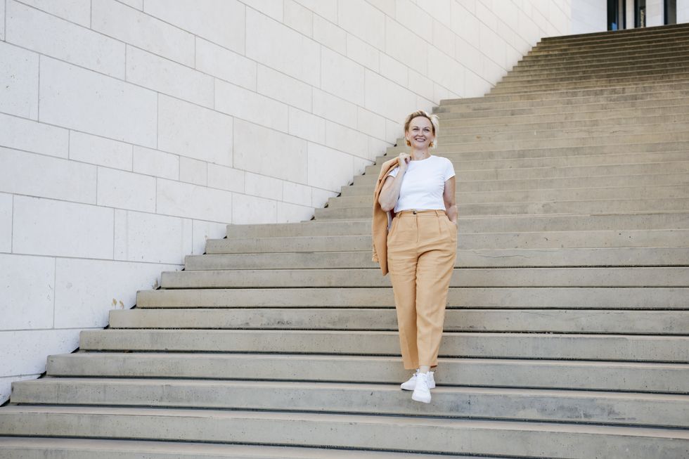 Woman in orange suit