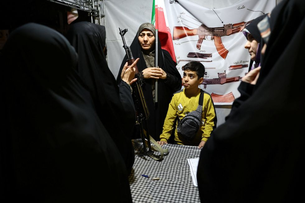 Woman in Tehran holding weapon