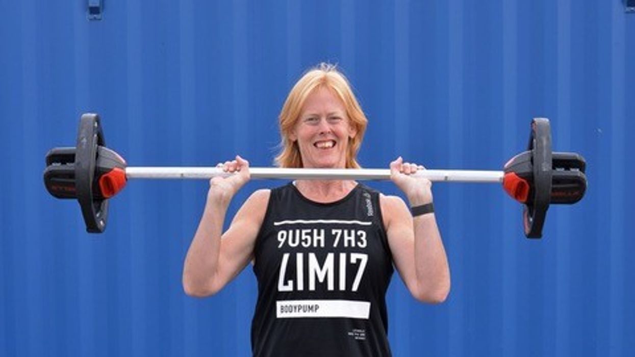 Woman lifting weights after weight loss