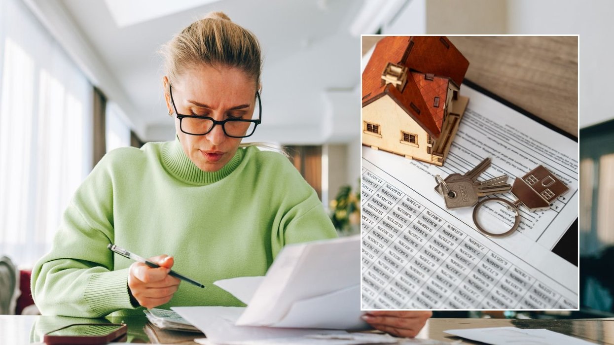 Woman looking at bill and mortgage deal