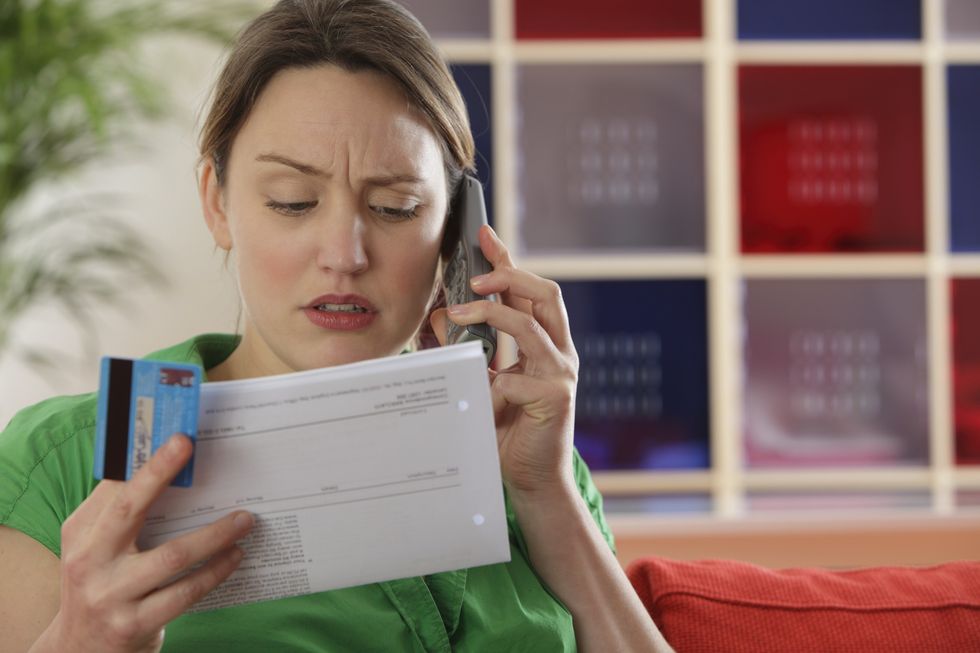 Woman looking at bill