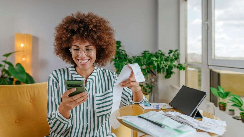 Woman looking at bill