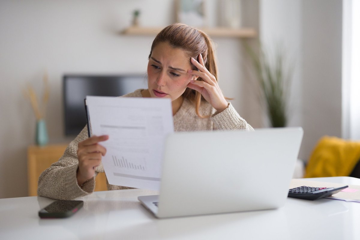 Woman looking at bill