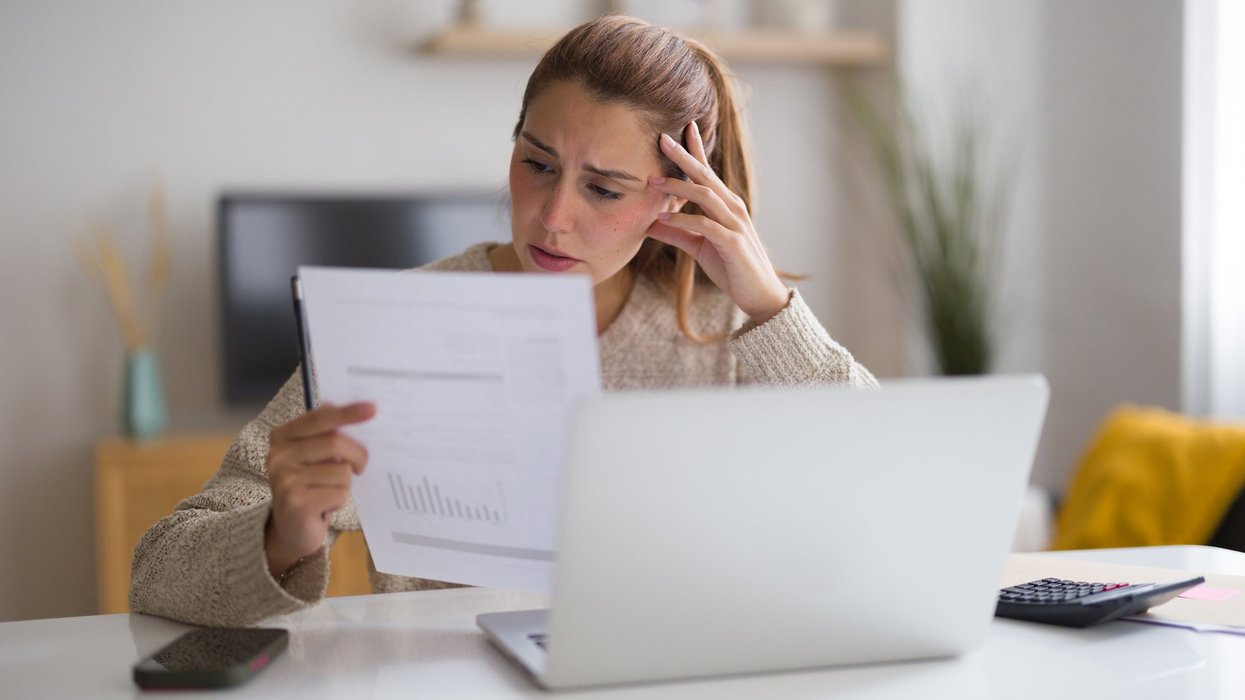 Woman looking at bill