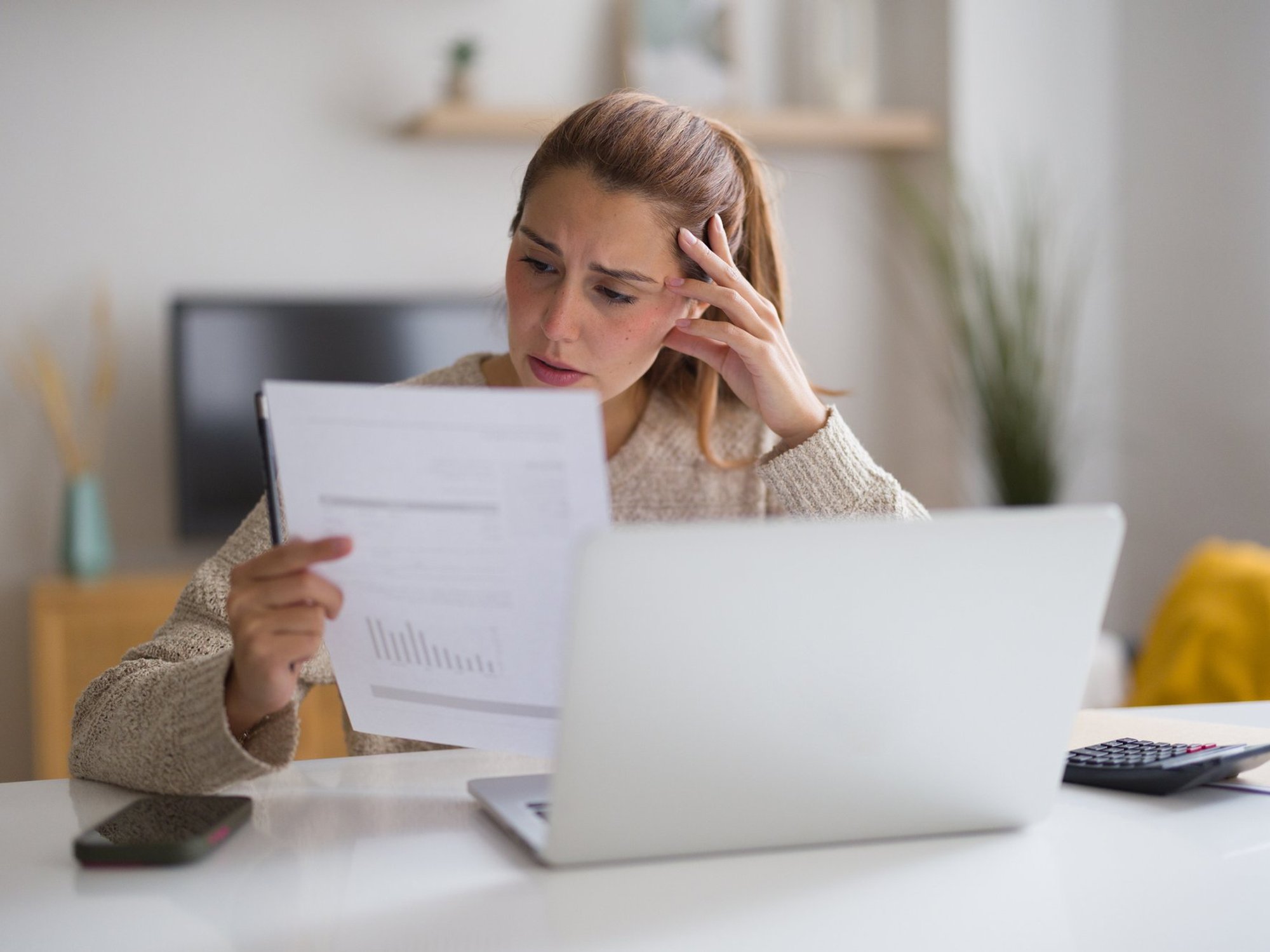 Woman looking at bill