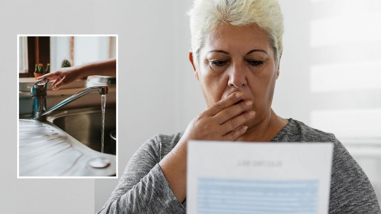 Woman looking at bills shocked