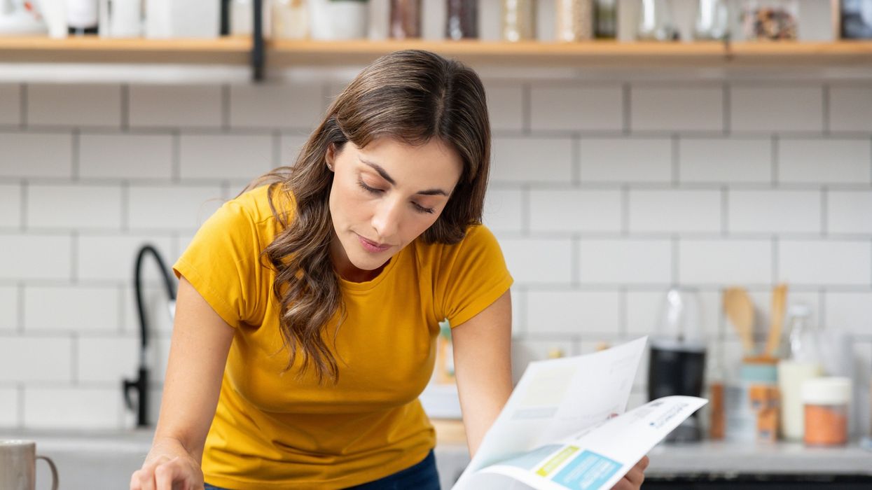 Woman looking at bills