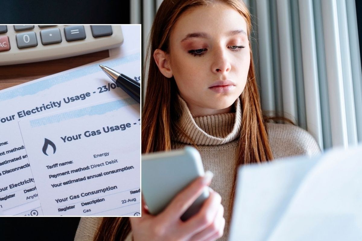 Woman looking at energy bill and energy bill
