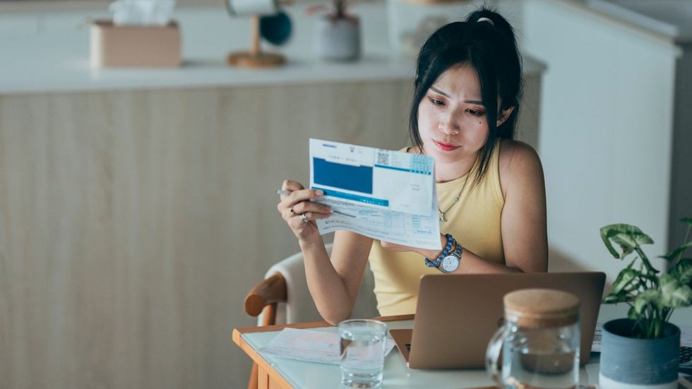 Woman looking at energy bills