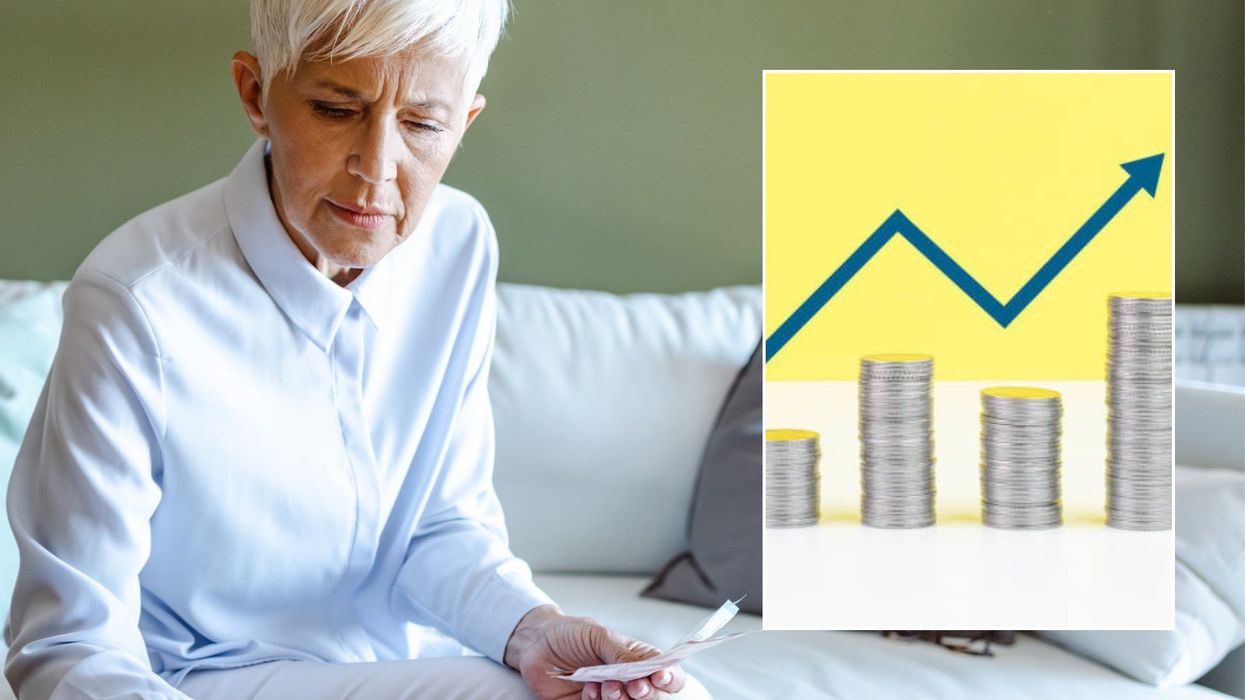 Woman looking at finances and interest rate graph