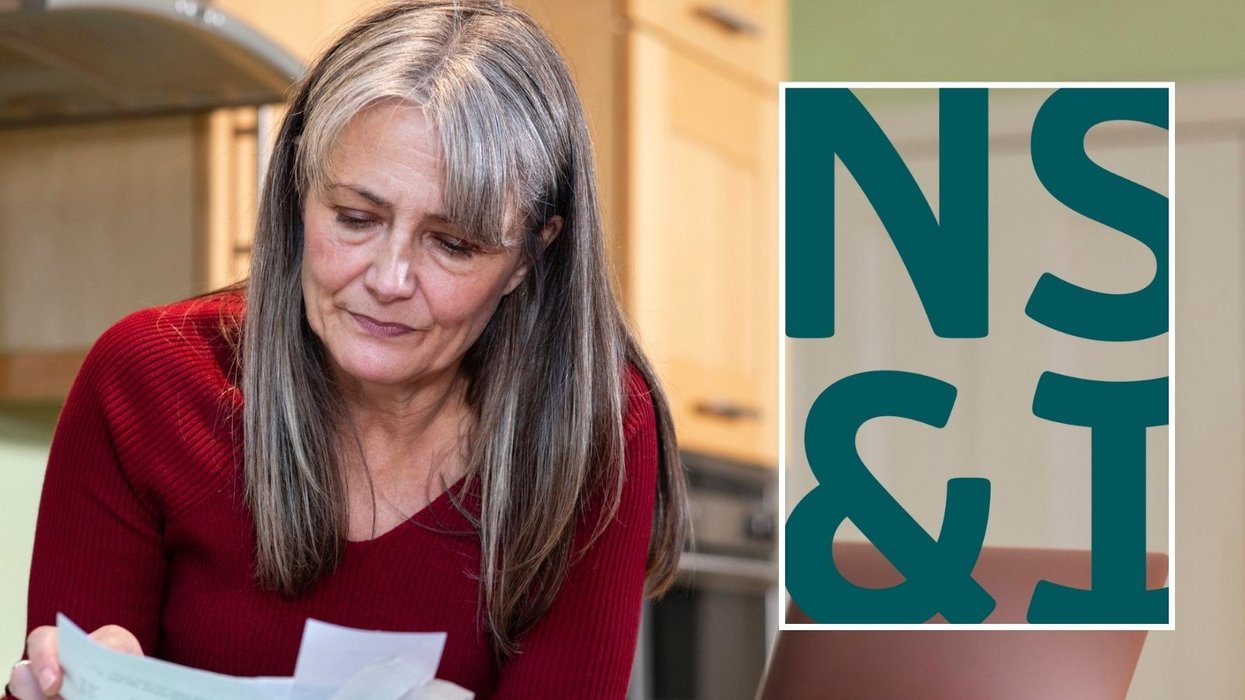 Woman looking at finances and NS&I logo