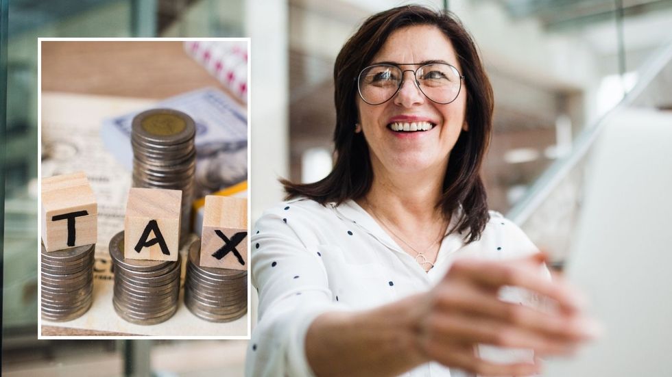 Woman looking at financial forms and tax