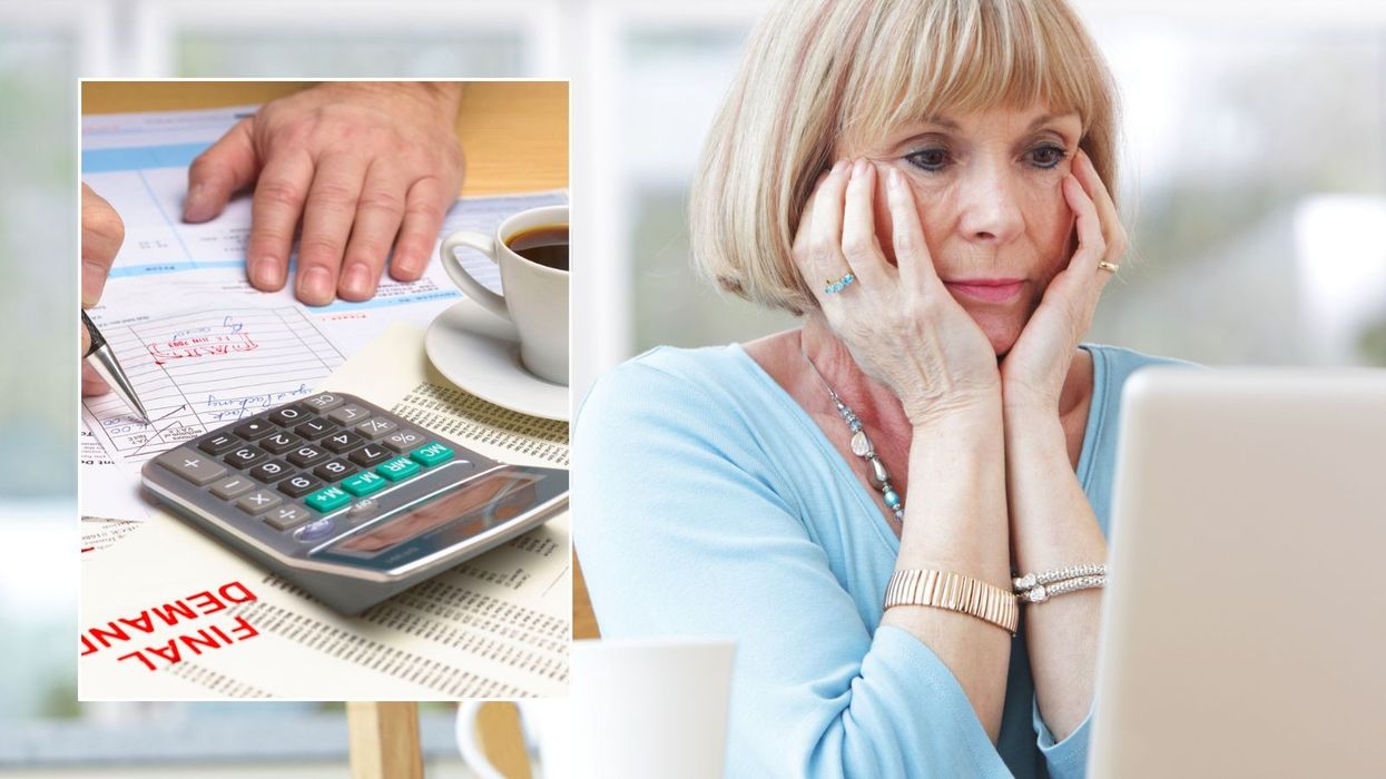 Woman looking at laptop and someone going over finances