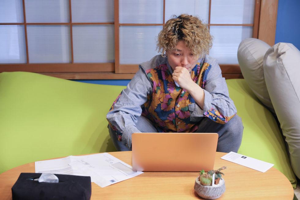 Woman looking at laptop