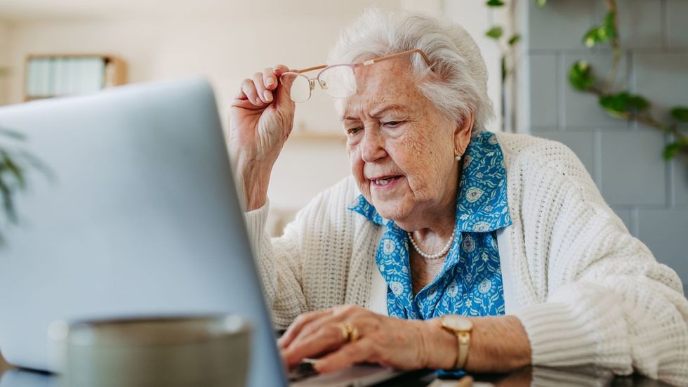 Woman looking at laptop