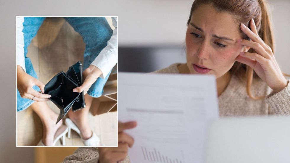 Woman looking at letter and empty pruse