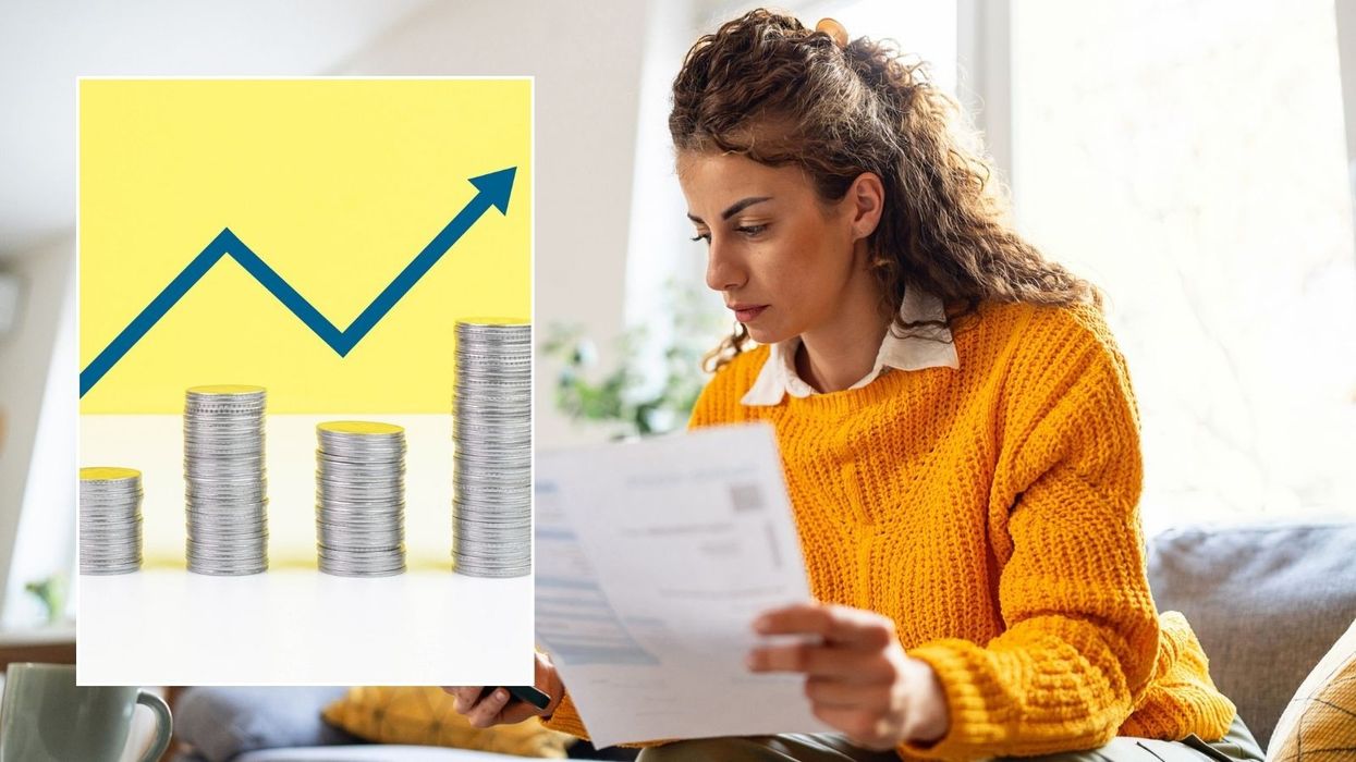Woman looking at letter and interest rate rise