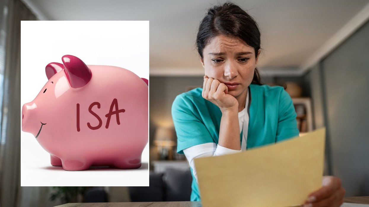 Woman looking at letter and ISA piggy bank