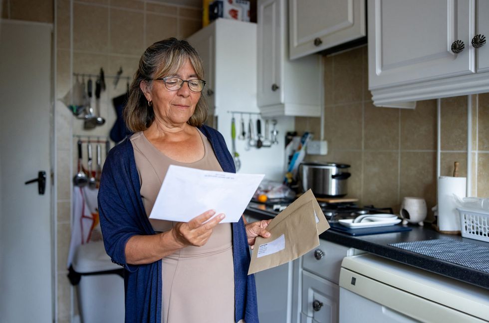 Woman looking at letter