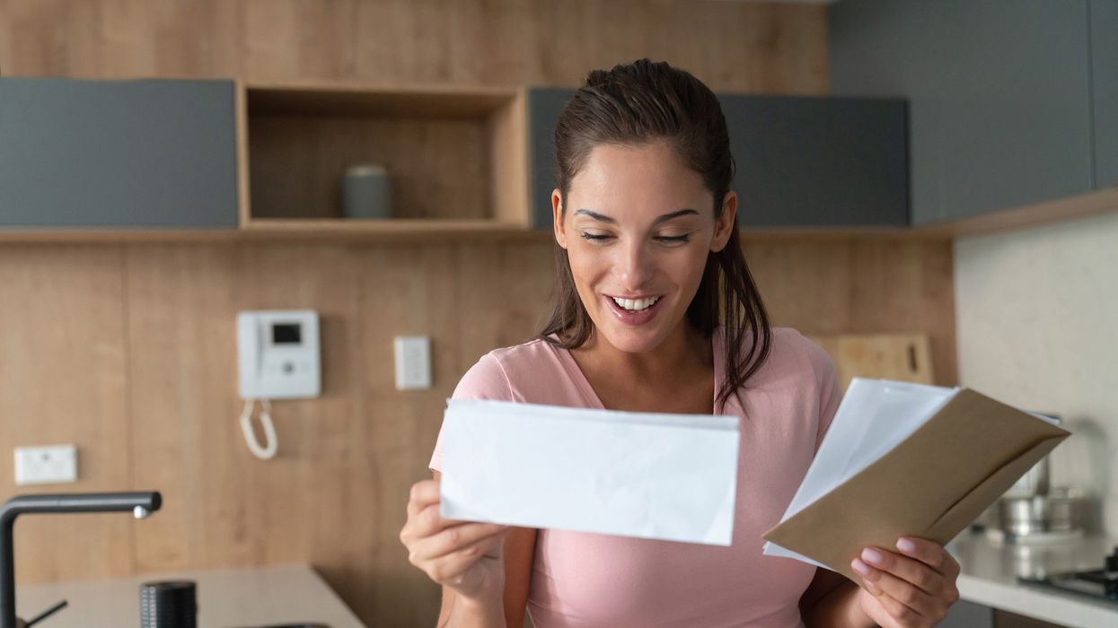 Woman looking at letter