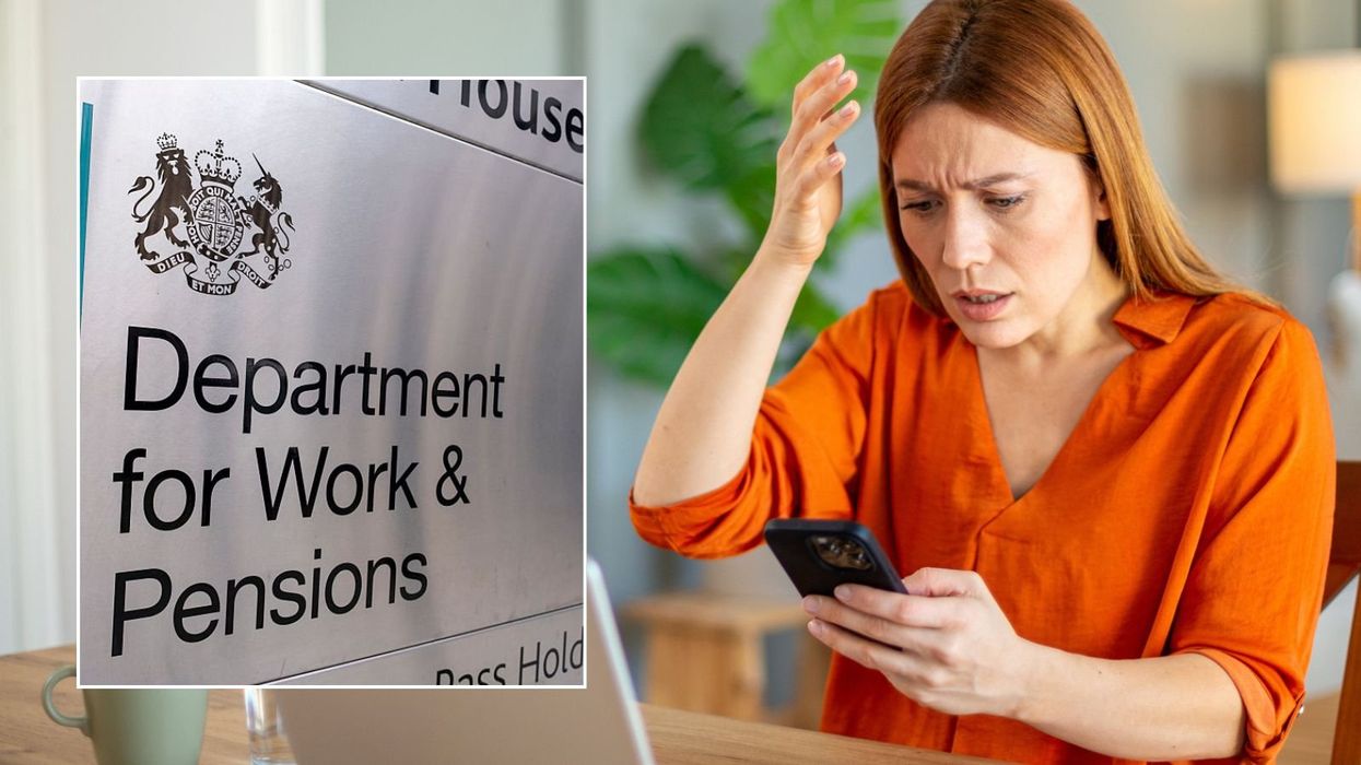 Woman looking at phone and DWP sign