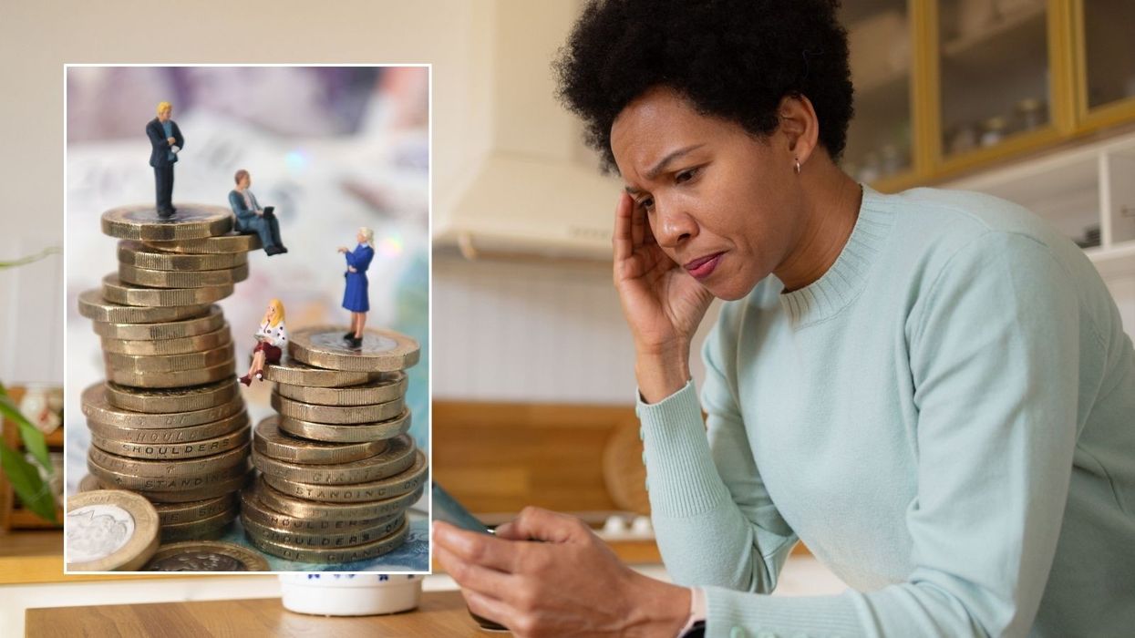 Woman looking at phone and money